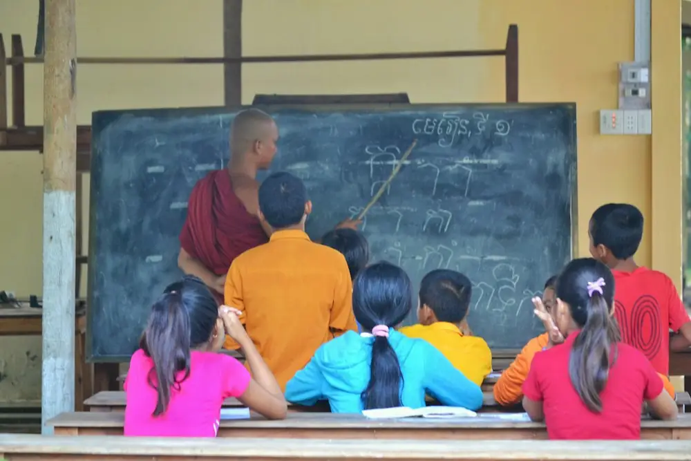 A teacher taking a class of schoolchildren